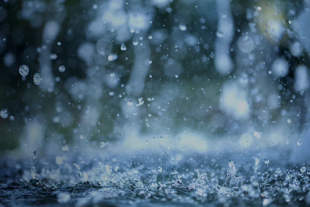 Rain splashing on a water surface